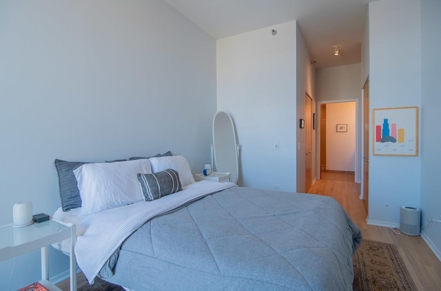 bedroom with light hardwood / wood-style flooring