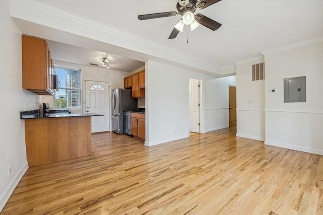 kitchen with kitchen peninsula, stainless steel fridge, electric panel, and light hardwood / wood-style flooring