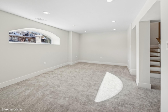 spare room featuring light colored carpet