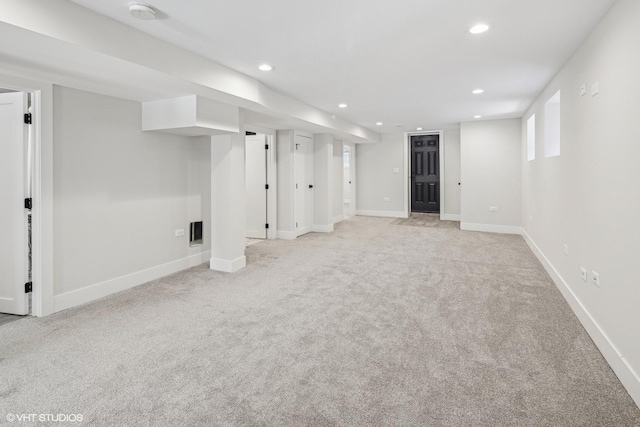 basement with light colored carpet