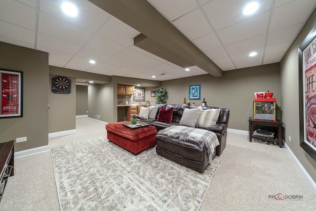 living room with indoor bar, light carpet, and a drop ceiling