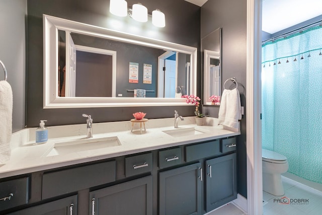 bathroom with tile patterned floors, toilet, a shower with shower curtain, and vanity