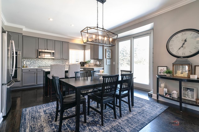 dining area featuring plenty of natural light and dark hardwood / wood-style flooring