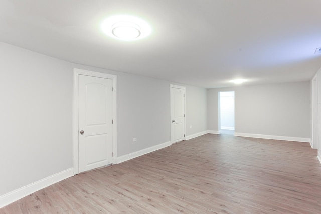 spare room with light hardwood / wood-style floors