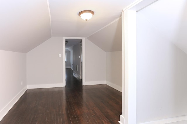 bonus room featuring dark wood-type flooring and lofted ceiling