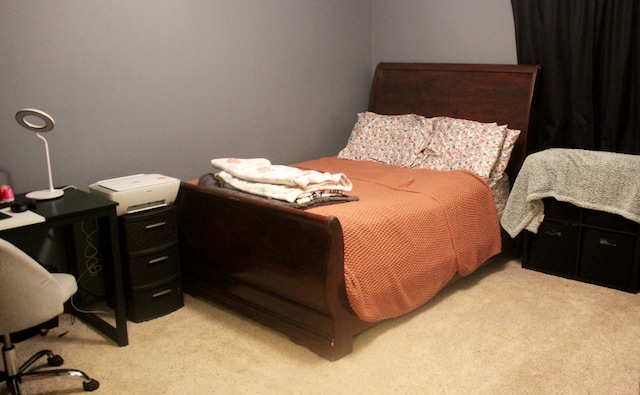 bedroom with light colored carpet