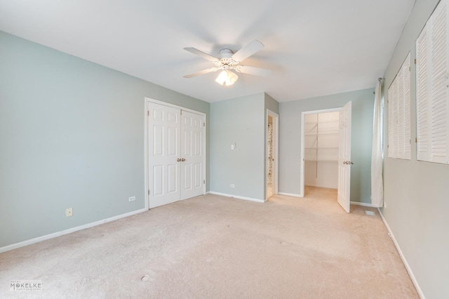 unfurnished bedroom featuring ceiling fan and light colored carpet