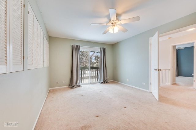 unfurnished bedroom featuring light carpet and ceiling fan