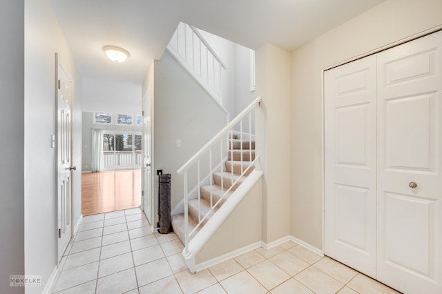 staircase with tile patterned floors