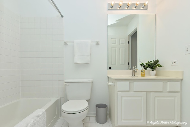 full bathroom with tile patterned flooring, vanity, toilet, and tiled shower / bath combo