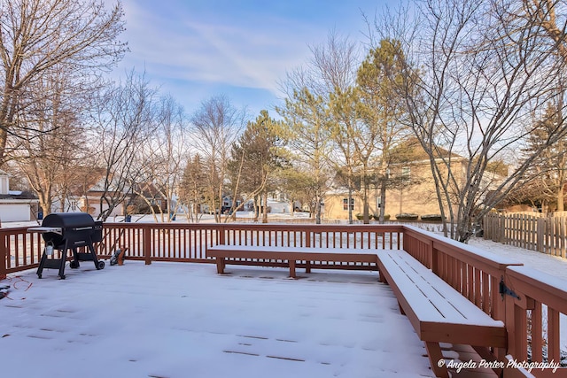 snow covered deck with grilling area