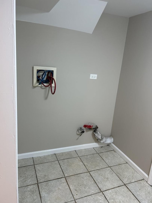 washroom with tile patterned floors and hookup for a washing machine