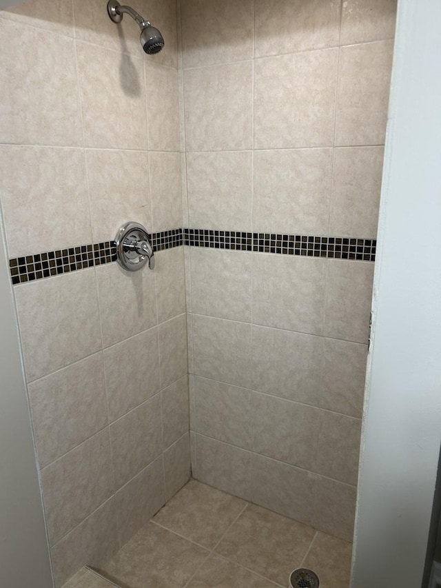 bathroom with tiled shower