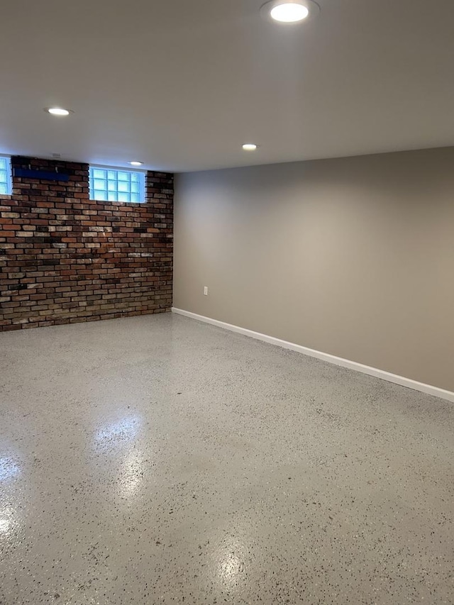 basement with brick wall