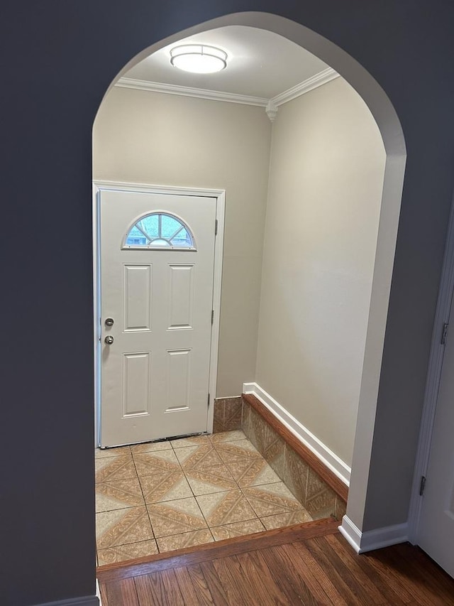 foyer entrance featuring ornamental molding