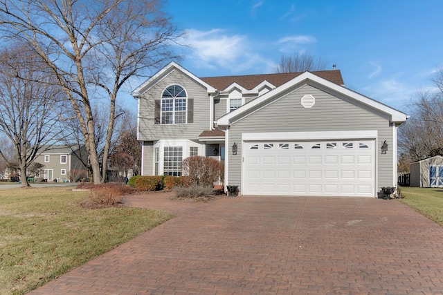 front facade with a garage and a front yard