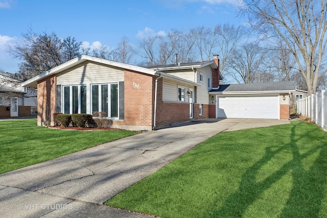 view of side of property with a lawn and a garage