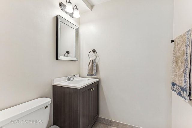 bathroom with tile patterned floors, vanity, and toilet