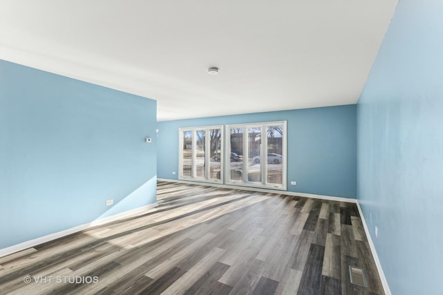 unfurnished room featuring wood-type flooring