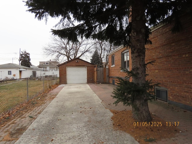 view of property exterior featuring an outdoor structure and a garage