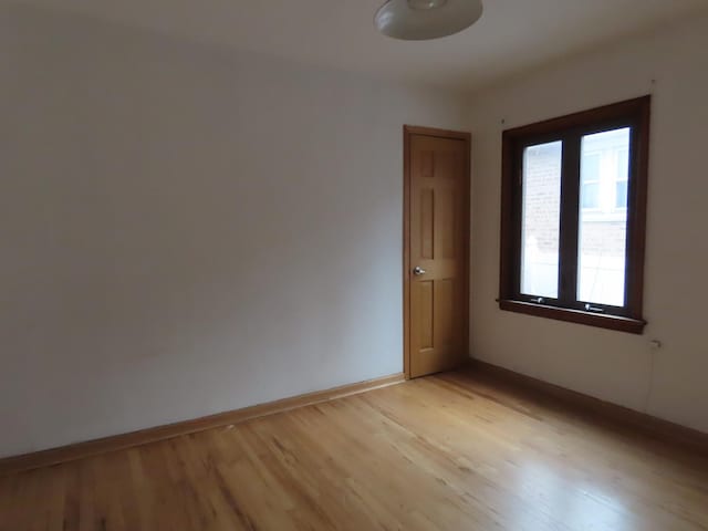 unfurnished room featuring light hardwood / wood-style floors