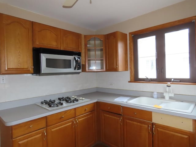 kitchen featuring white gas cooktop and sink