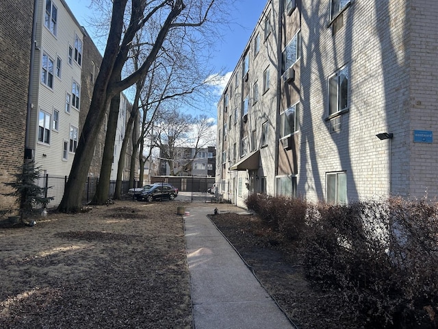 view of property's community featuring fence