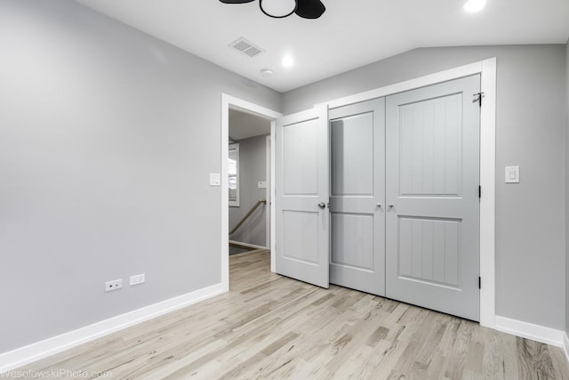 unfurnished bedroom with ceiling fan, a closet, and light hardwood / wood-style flooring