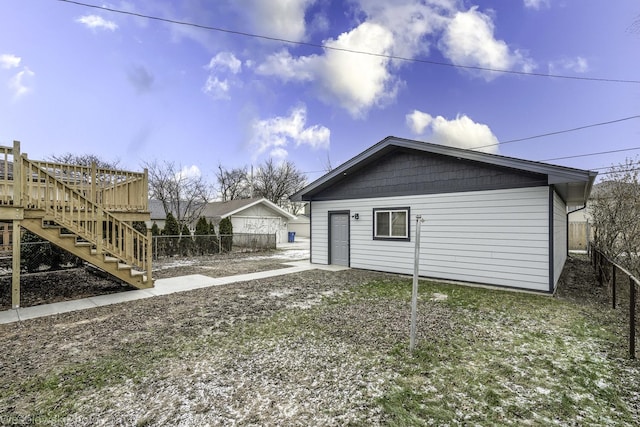 view of property exterior featuring a deck