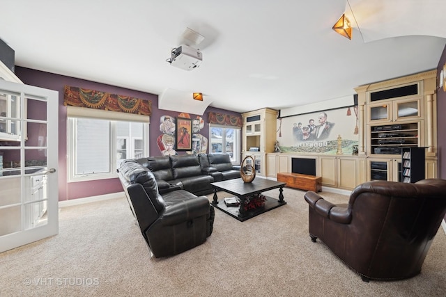 carpeted living room with beverage cooler