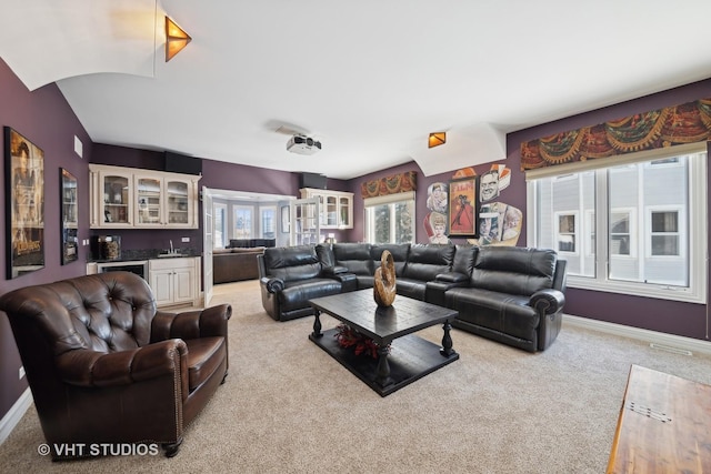 carpeted living room with bar