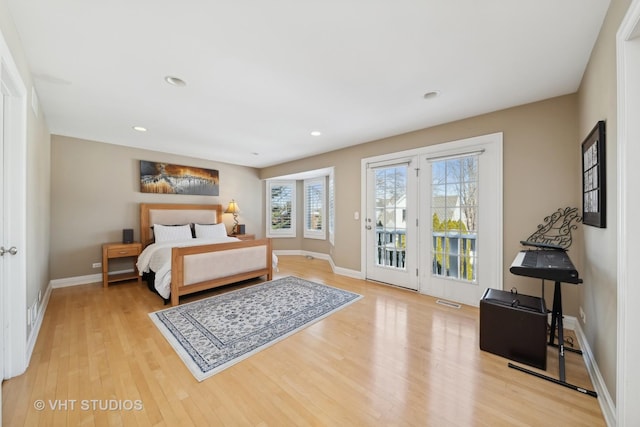 bedroom featuring access to outside and light wood-type flooring