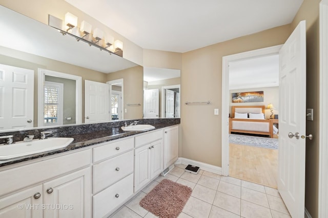 bathroom with tile patterned flooring and vanity