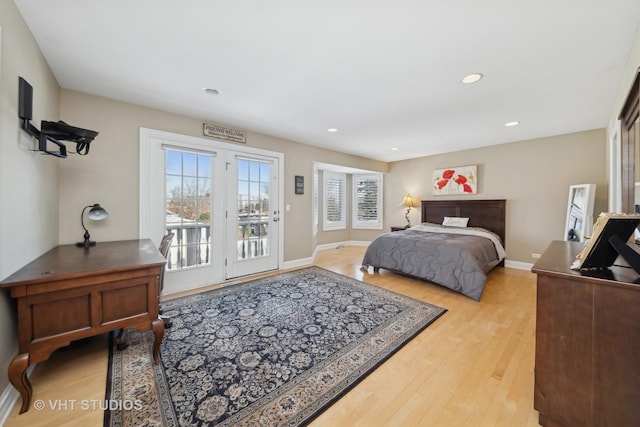 bedroom featuring light hardwood / wood-style flooring and access to outside