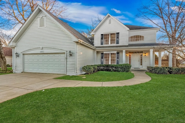 view of front of home featuring a front lawn and a garage