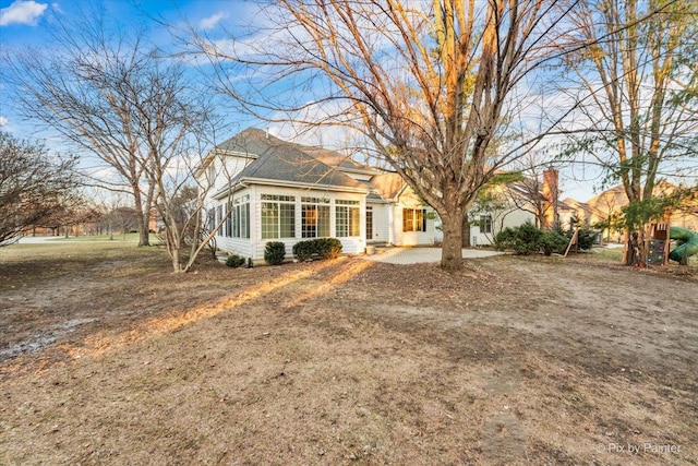 view of front facade featuring a sunroom