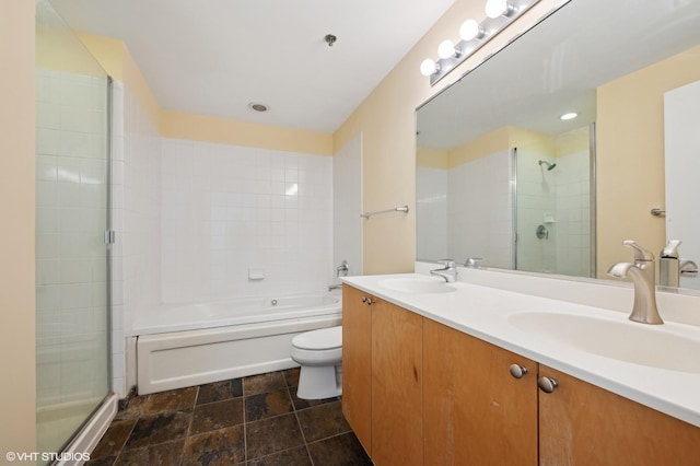 full bathroom featuring shower with separate bathtub, vanity, and toilet