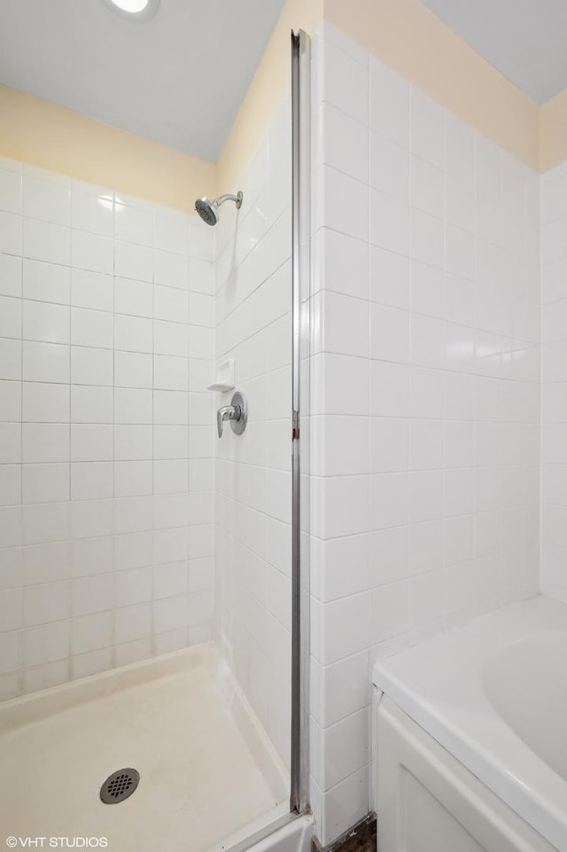 bathroom with tiled shower