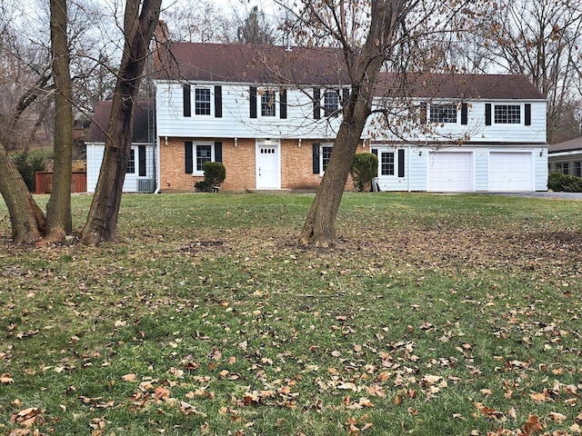 view of front facade with a front yard and a garage