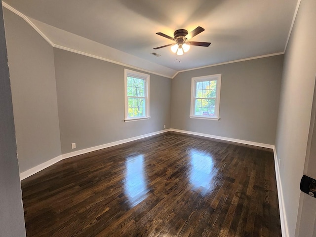 unfurnished room featuring dark hardwood / wood-style floors, ceiling fan, lofted ceiling, and crown molding