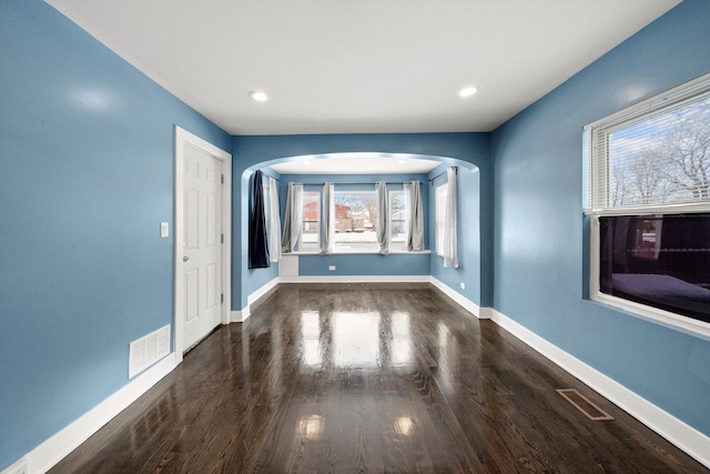 spare room with dark hardwood / wood-style floors