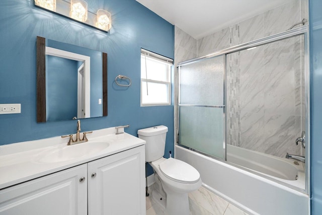 full bathroom featuring vanity, toilet, and shower / bath combination with glass door