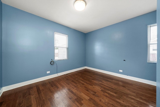 spare room featuring hardwood / wood-style floors