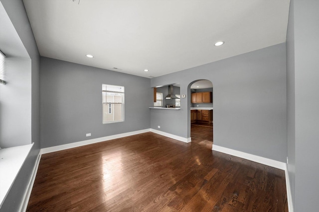 unfurnished living room with dark hardwood / wood-style floors