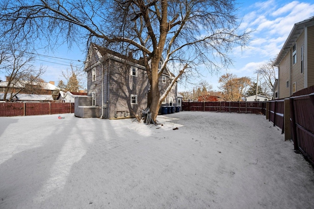 view of yard layered in snow