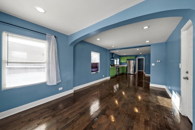 unfurnished living room featuring hardwood / wood-style flooring