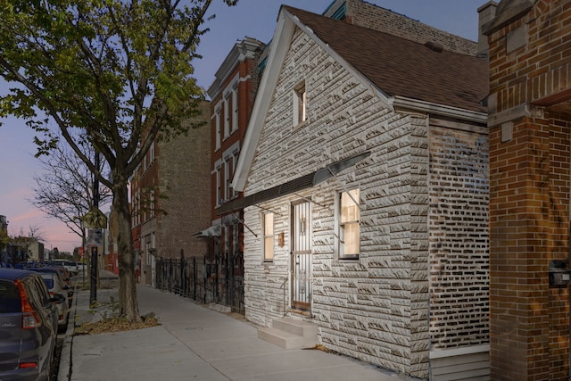 view of property exterior at dusk