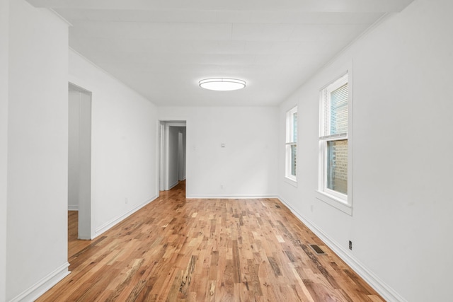 spare room with light wood-type flooring