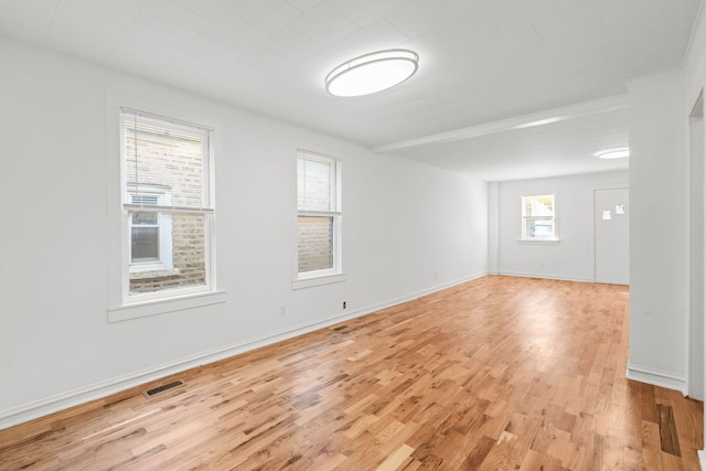 unfurnished room with light hardwood / wood-style flooring