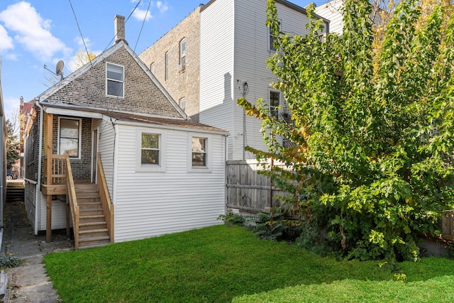 view of home's exterior featuring a lawn